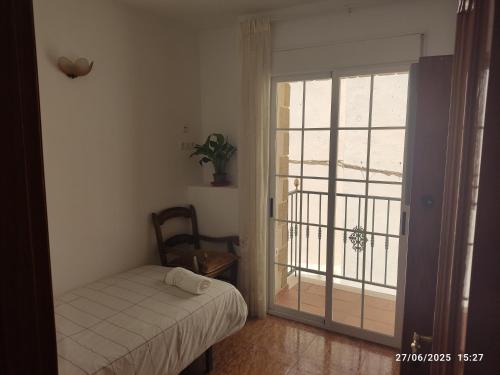 Ένα ή περισσότερα κρεβάτια σε δωμάτιο στο La casa del abuelo