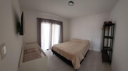 Ένα ή περισσότερα κρεβάτια σε δωμάτιο στο El Rincón de Gemma