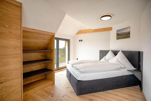 Katil atau katil-katil dalam bilik di Ferienhaus Bergziege