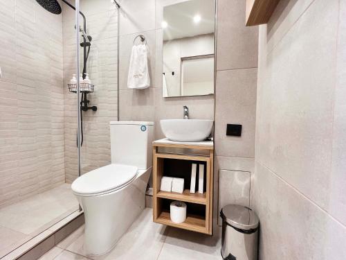 a small bathroom with a toilet and a sink at Motives Inn Dilijan in Dilijan