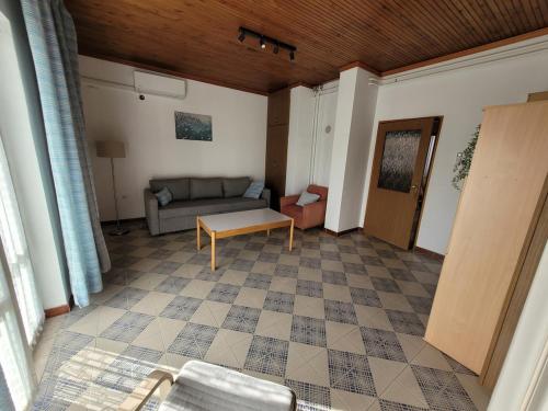 a living room with a couch and a table at Apartment Kaktus in Pirovac