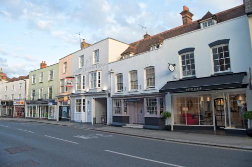 a row of buildings on a city street at White Horse in Maldon