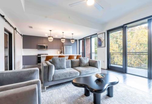 a living room with a couch and a table at Cozy Apartment in Atlanta in Atlanta