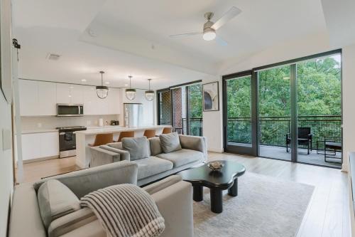 a living room with a couch and a table at Cozy Apartment in Atlanta in Atlanta