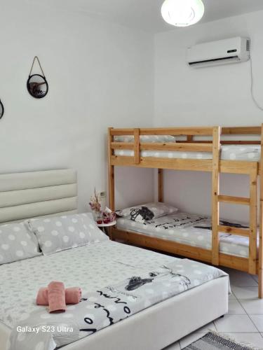 a bedroom with two bunk beds at Tomi's Orikum Apartments in Orikum