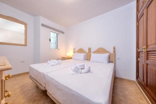 Katil atau katil-katil dalam bilik di Apartamento El Charcon A