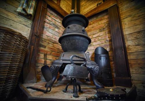 a statue of a robot sitting on a table at The Karal cabin in Canterbury