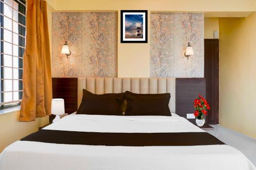 Ένα ή περισσότερα κρεβάτια σε δωμάτιο στο Hotel O Veerbhadra Nagar Baner