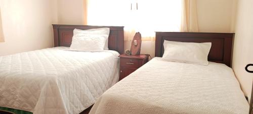 Ένα ή περισσότερα κρεβάτια σε δωμάτιο στο Casa El Guayacan