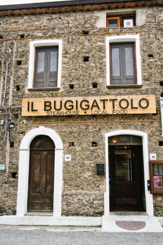 a building with a sign on the side of it at Wake&Relax in Decollatura