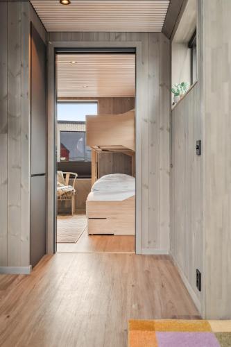 a bedroom with a bunk bed in a house at Rorbuleilighet 1J Henningsvær in Henningsvær