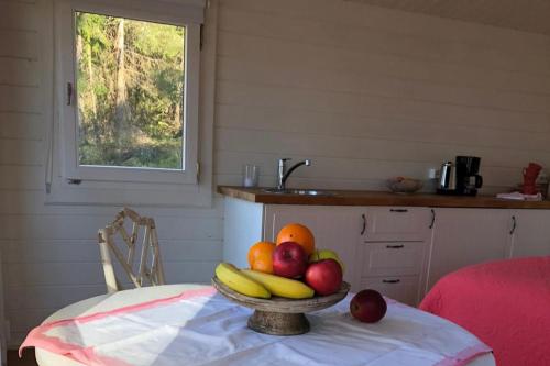 a bowl of fruit on a table in a kitchen at Lillstugan in Gustavsberg