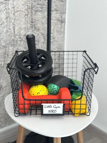 a wire basket with eggs on a table at Design City Apartment, Dachterrasse, Top Lage in Schwetzingen