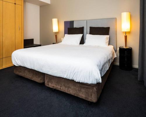 Ένα ή περισσότερα κρεβάτια σε δωμάτιο στο One bedroom Hospitality Suite