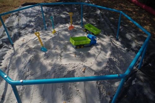 a toy playground in the snow with a train at CHEZ MITCH EN CAMPING CAR et grand espace extérieur in Caillavet