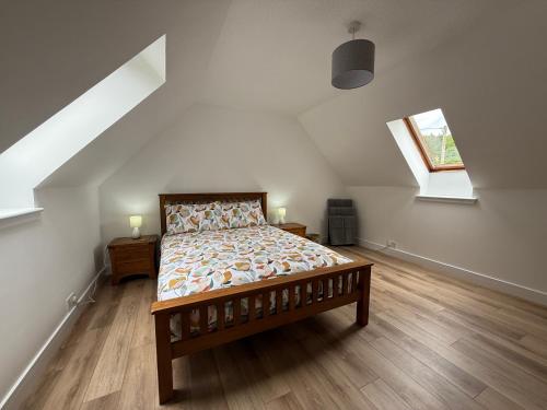a bedroom with a bed in a attic at Highland Nook in Fort William