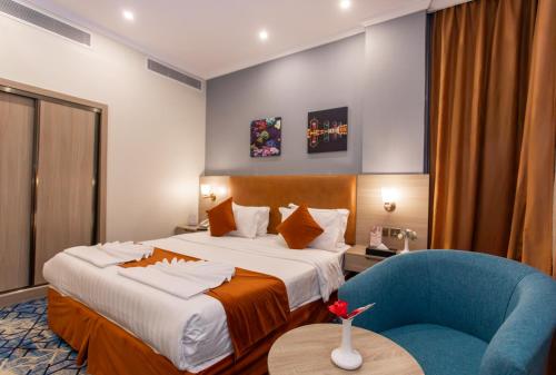 Katil atau katil-katil dalam bilik di Signature Guest Hotel فندق إمضاء النزيل الفندقية