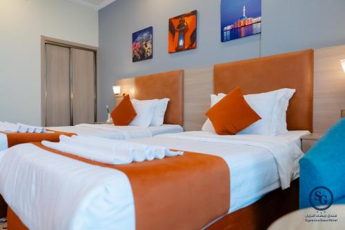 Katil atau katil-katil dalam bilik di Signature Guest Hotel فندق إمضاء النزيل الفندقية