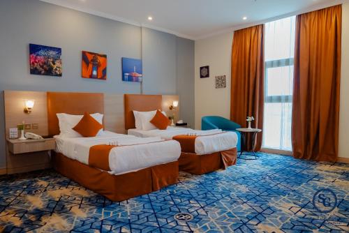 Katil atau katil-katil dalam bilik di Signature Guest Hotel فندق إمضاء النزيل الفندقية