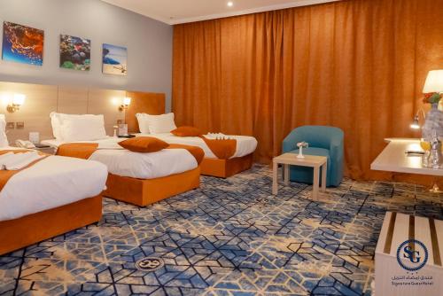 Katil atau katil-katil dalam bilik di Signature Guest Hotel فندق إمضاء النزيل الفندقية