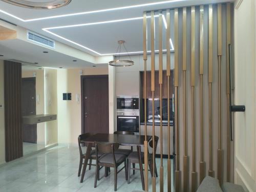 a dining room with a table and chairs at My Loft in Bejaia in Bejaïa
