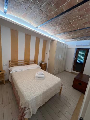 Ένα ή περισσότερα κρεβάτια σε δωμάτιο στο Rustico Valentina