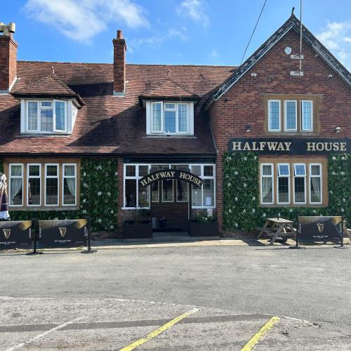a large brick building with a harney way house at Halfway House Inn Country Lodge in Yeovil