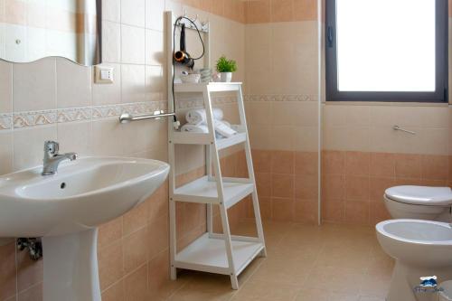 a bathroom with a sink and a toilet at PARCO DELLE STELLE in Castelmauro
