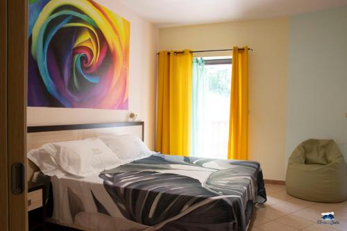 a bedroom with a bed and a window at PARCO DELLE STELLE in Castelmauro