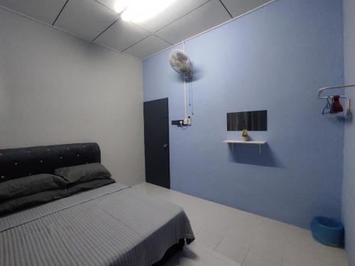 Ένα ή περισσότερα κρεβάτια σε δωμάτιο στο Munadibstay Dzul