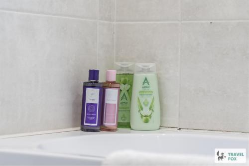 a shelf with three bottles of moisturizers on it at Lisa's House in Leek