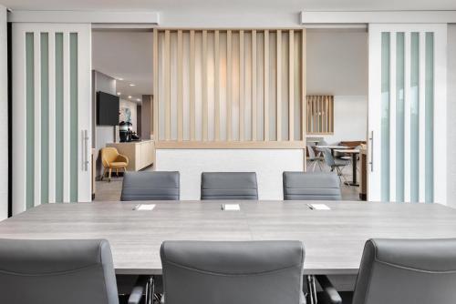 a conference room with a large table and chairs at TownePlace Suites by Marriott Chattanooga South, East Ridge in Chattanooga