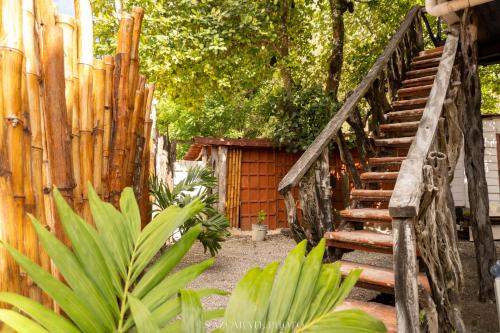 a wooden staircase next to a wooden fence at Semper Fidelis Camp in Solferino 