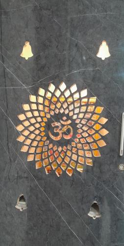 a design on the floor of a building with the number six at Venya Vihar a Deluxe 2 BHK Home Stays in Visakhapatnam