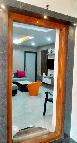a view of a living room through a mirror at Venya Vihar a Deluxe 2 BHK Home Stays in Visakhapatnam