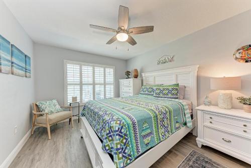 a bedroom with a bed and a ceiling fan at Forget Me Knot in Bradenton