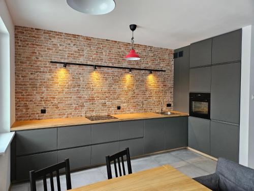 Kuchyň nebo kuchyňský kout v ubytování Apartament PROMYKA