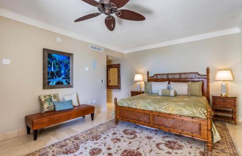 a bedroom with a bed and a ceiling fan at Honua Kai Resort And Spa By Maui Resort Rentals in Lahaina
