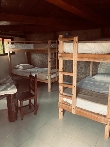 a room with three bunk beds and a chair at Semper Fidelis Camp in Solferino 