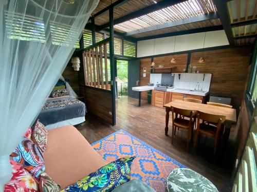 a living room with a couch and a table at La Shamana - Ecological Concept in Jungle in Cahuita