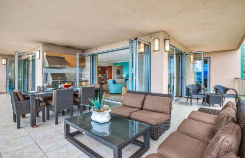 a living room with a couch and a table at Honua Kai Resort And Spa By Maui Resort Rentals in Lahaina