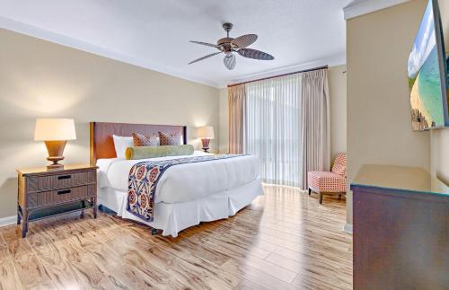 a bedroom with a bed and a ceiling fan at Honua Kai Resort And Spa By Maui Resort Rentals in Lahaina