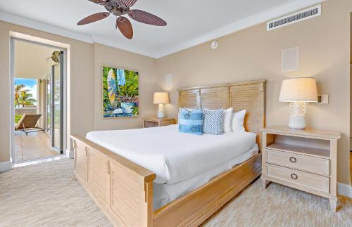 a bedroom with a bed and a ceiling fan at Honua Kai Resort And Spa By Maui Resort Rentals in Lahaina