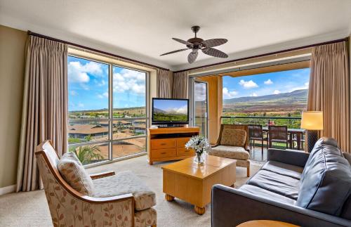 a living room with a couch and a tv at Honua Kai Resort And Spa By Maui Resort Rentals in Lahaina