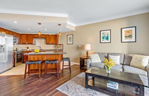 a living room with a couch and a table at Honua Kai Resort And Spa By Maui Resort Rentals in Lahaina