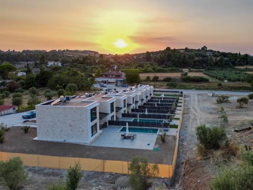 an aerial view of a building with a pool at The Olive Path in Kalandra