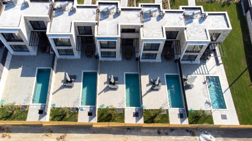 an aerial view of a building with a swimming pool at The Olive Path in Kalandra