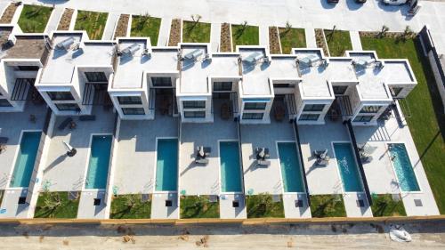 an overhead view of a building with a pool at The Olive Path in Kalandra