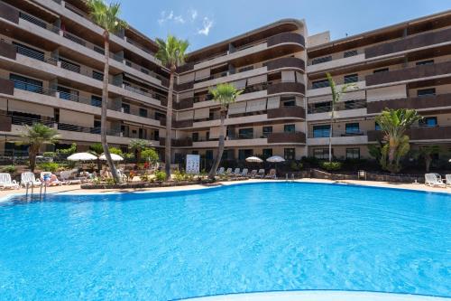 a large swimming pool in front of a building at El Teide in Puerto de Santiago