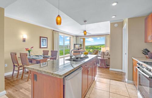 a kitchen and dining room with a table and chairs at Honua Kai Resort And Spa By Maui Resort Rentals in Lahaina